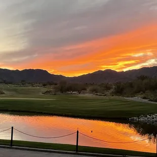 a golf course at sunset