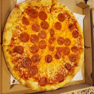 a pepperoni pizza in a box