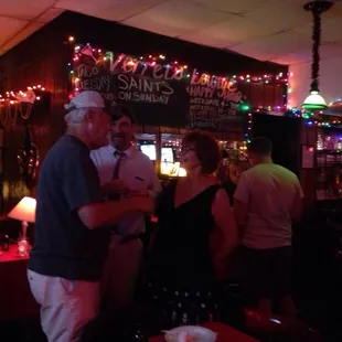 Peeps aside of the bar watching the band and socializing