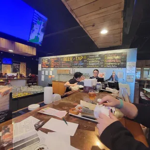Bar with tap list on the wall