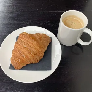 Coffee and a fresh croissant baked in the store each morning