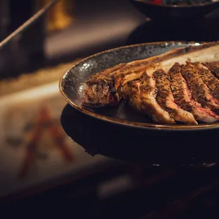 38oz Tomahawk (for 2).. Bone Marrow, Heirloom Tomato, Charred Lime  Our tomahawk is aged for about a week and gets cooked over almond wood.