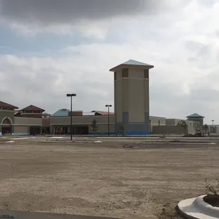 a parking lot with a clock tower