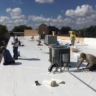 workers working on a flat roof