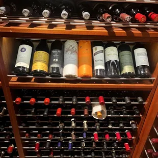 a wine rack full of wine bottles