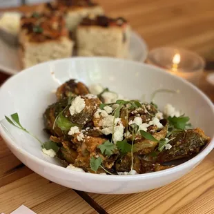 a bowl of food on a wooden table