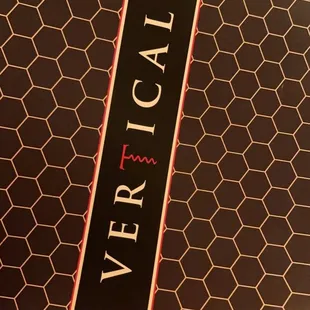 a person holding a black and red book