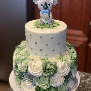 a cake with a koala on top