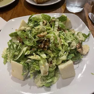Shaved Brussel sprout salad with apple, Brie and walnuts.