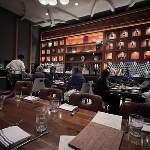 a restaurant with people sitting at tables