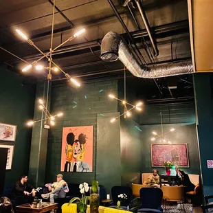 people sitting at tables in a restaurant