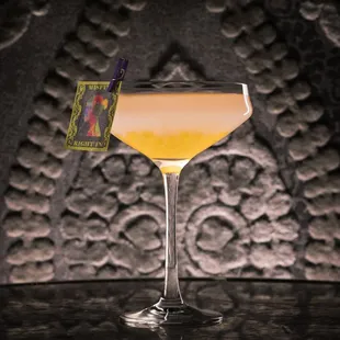 Penny Black (Avuá Amburana &amp; Prata Cachaça, Black Pepper &amp; Cardamom Honey, Lime, Passionfruit Pearls and Sparkling Rosé)