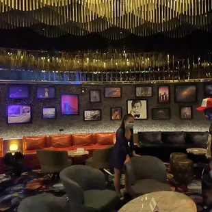 a group of people sitting around a bar