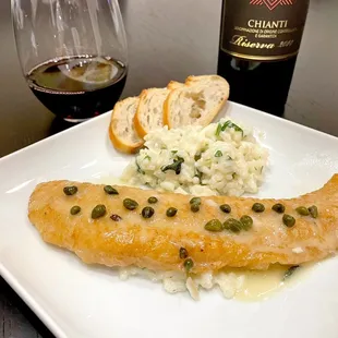 Petrale Sole entrée with capers, creamy risotto side, baguette. Red Chianti wine.