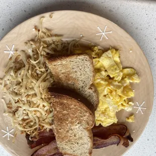 2 eggs scrambled, hashbrowns, bacon and wheat toast