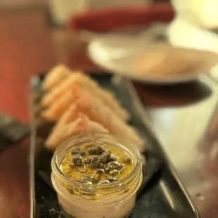 a plate of bread and dip