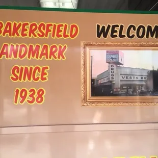 a welcome sign for a baker&apos;s field landmark since 1938