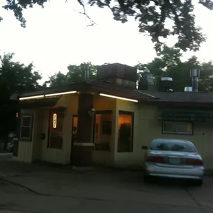a car parked in front of a restaurant