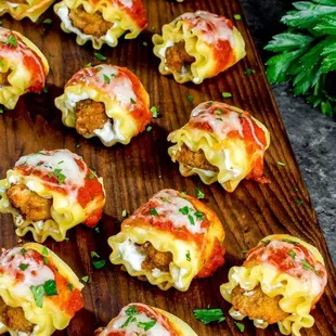 Lasagna noodles stuffed with chicken and ricotta cheese. Finished with home made marina sauce and mozzarella cheese.