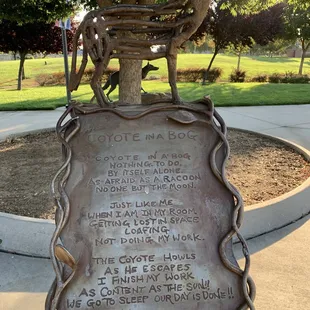 Coyote statue and poem