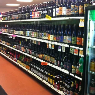 rows of bottles of beer in a store
