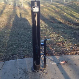 A fancy bike repair station, complete with QR code to find repair help!