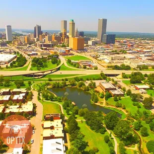 Aerial view of Tulsa with Centennial Park in the front.