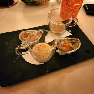 Pre-dinner bites: raw oysters with salmon roe + celery root soup.