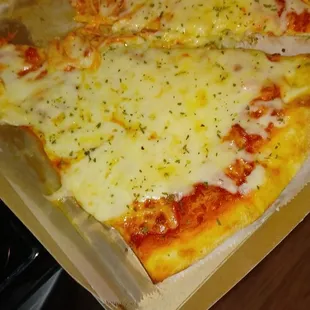 Two slices extra cheese...minus a bite!