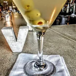 a martini with olives in it
