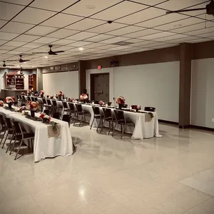 a banquet room with tables and chairs