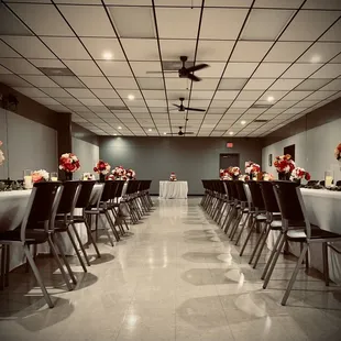 a banquet room with tables and chairs
