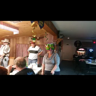 a man in a hat and a woman in a striped shirt