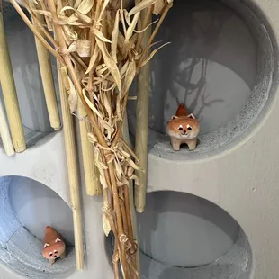 Tiny Shiba Inu figurines By the kiosk