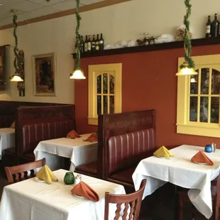 a dining area with tables and chairs