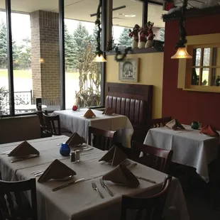 a dining area with tables and chairs
