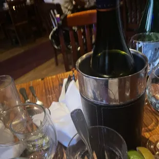 a bottle of wine and glasses