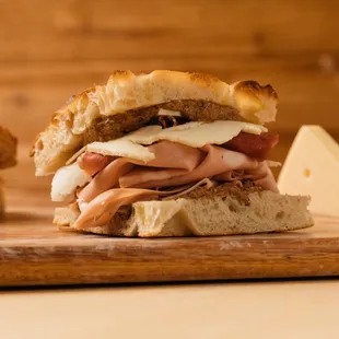 a sandwich with meat and cheese