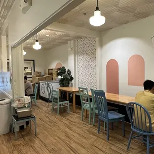 people sitting at tables in a restaurant
