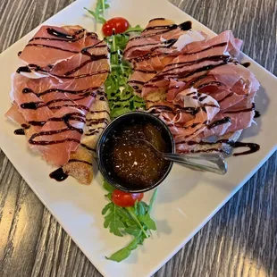 Le Bruschette: Pane Rustico with Prosciutto, Arugula, and Fig Jam
