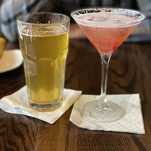 two cocktails on a wooden table