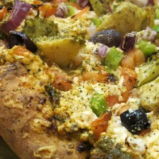 Spinach-everything pizza