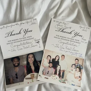 a couple of thank cards on a bed