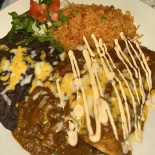 Pork tamale, beef enchilada, black beans and rice. Pretty good. The beef was a lil dry though