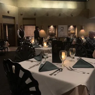 a dining room with tables and chairs