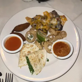 Appetizer platter. Nothing good to write about.  Zoom in on the raw spinach and cold melted cheese in the quesadilla.