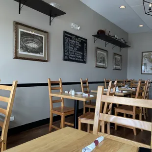 a dining room with tables and chairs