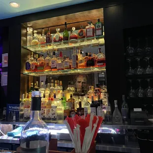 a bar filled with liquor bottles