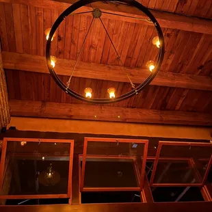 a circular chandelier hanging from the ceiling