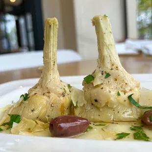 a plate of artichokes and olives